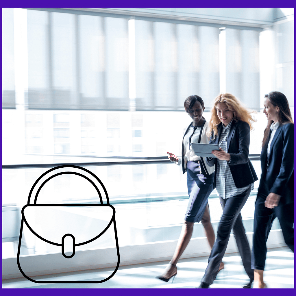 Three women in business suits in an office