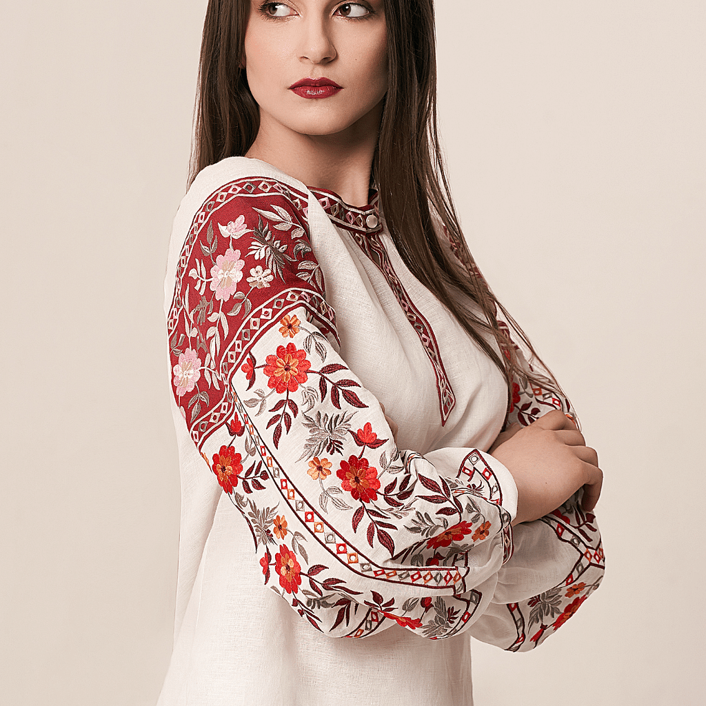 A woman wearing a natural boho-style shirt. Ukrainian embroidered shirt